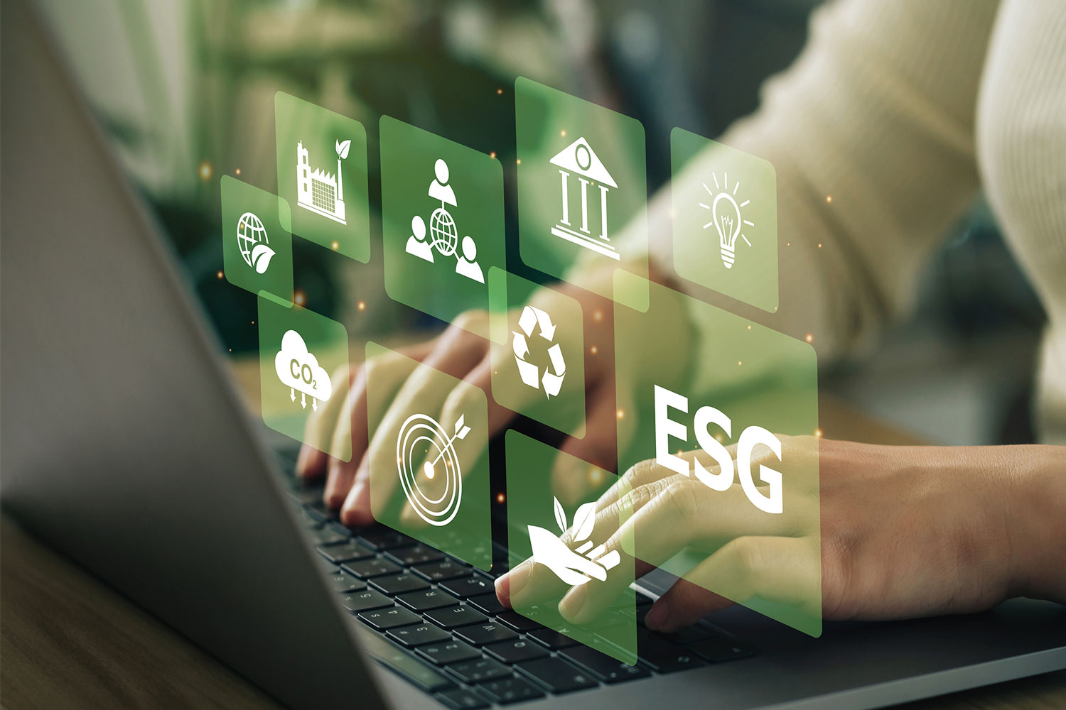 Laptop user with digital ESG icons